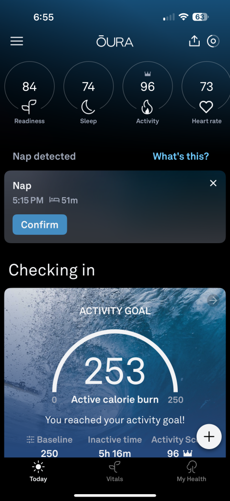 An Oura Ring health app interface displays readiness, sleep, activity, and heart rate scores. A nap detection alert appears alongside the activity goal of 253 active calories burned, goal reached.